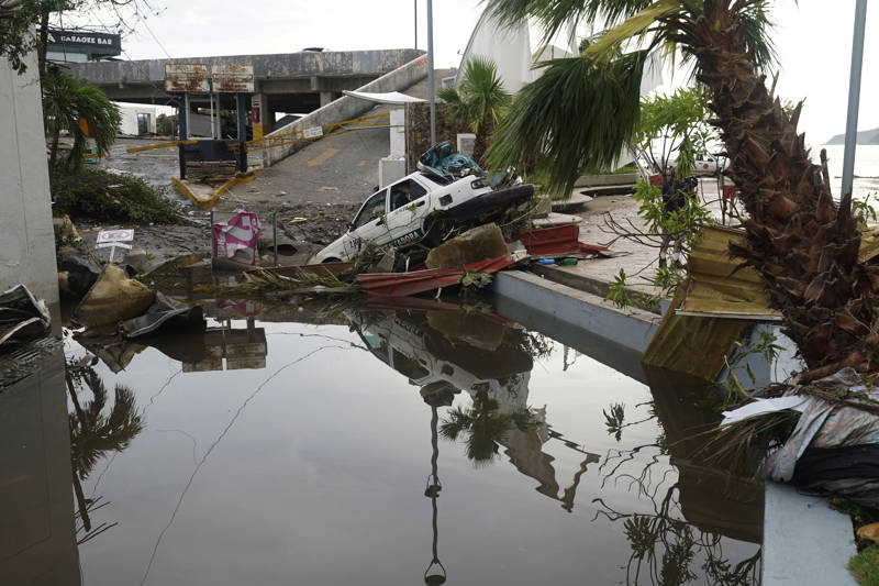 A street is strewn with debris after Hurricane Otis ripped through Acapulco, Mexico, Wednesday, Oct. 25, 2023. Hurricane Otis ripped through Mexico's southern Pacific coast as a powerful Category 5 storm, unleashing massive flooding, ravaging roads and leaving large swaths of the southwestern state of Guerrero without power or cellphone service. (AP Photo/Marco Ugarte)
